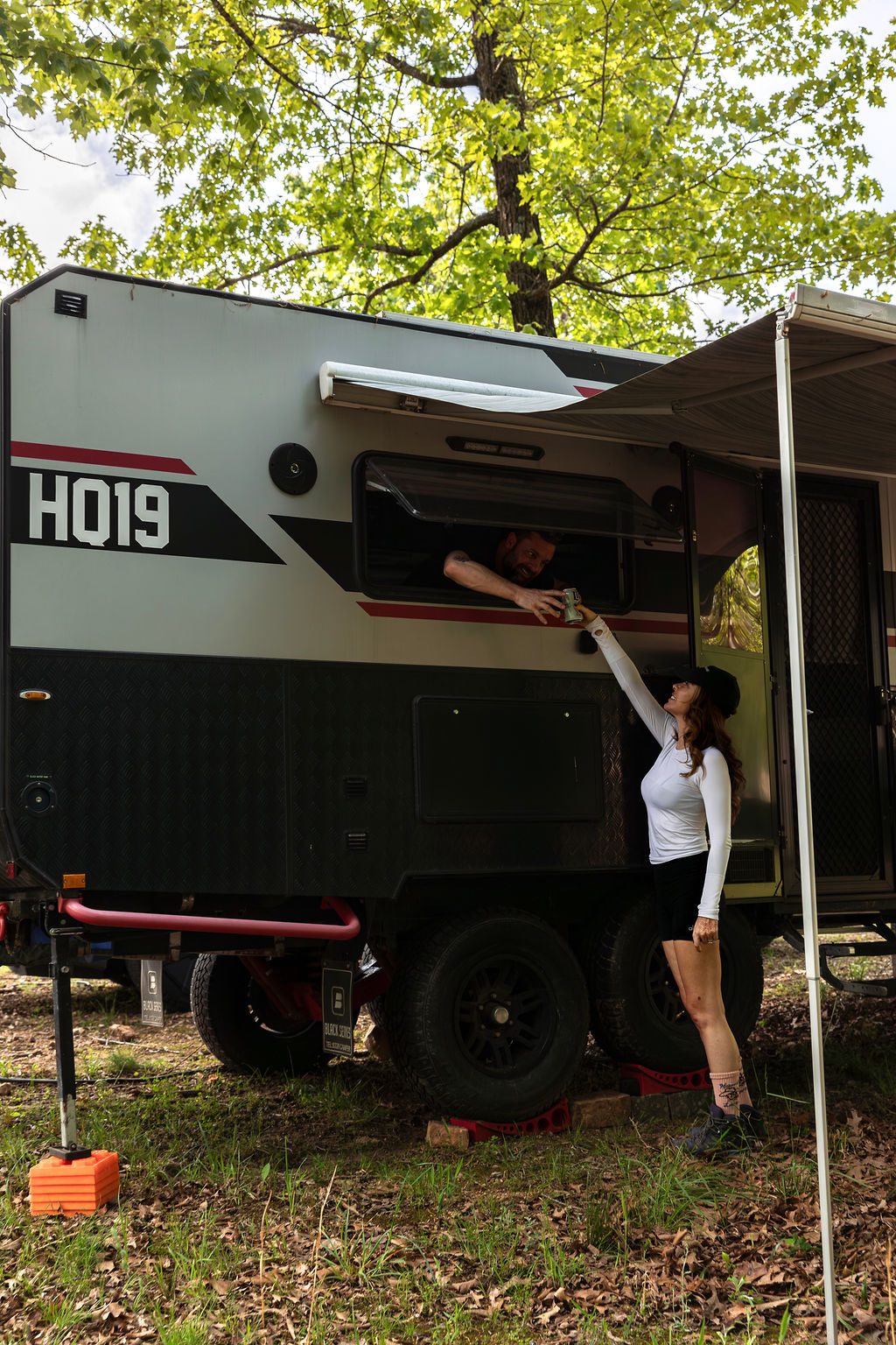 Cybertruck parked beside the camper